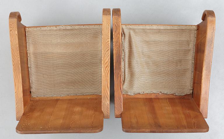 Axel Einar Hjorth, attributed, a pair of stained pine "Lovö" easy chairs, Nordiska Kompaniet, Sweden 1930's.