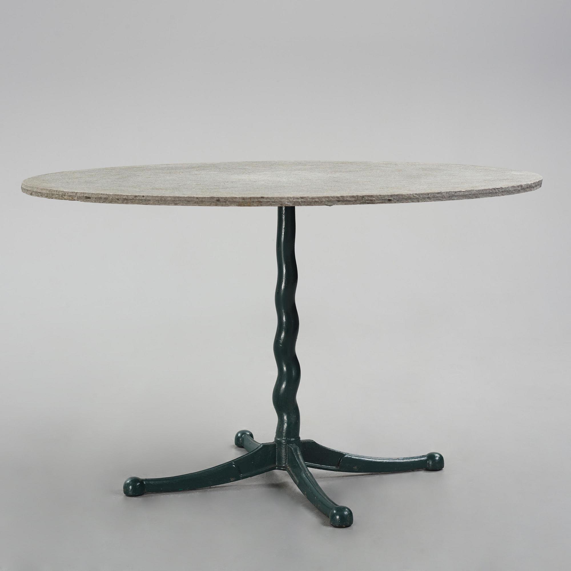 Josef Frank, attributed to, a cast iron table with granite top, Firma Svenskt Tenn, Sweden, 1930s-40s.