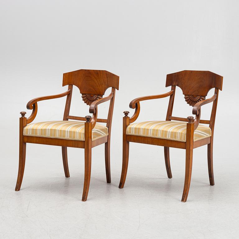 A pair of Swedish Empire mahogany open armchairs, early 19th century.