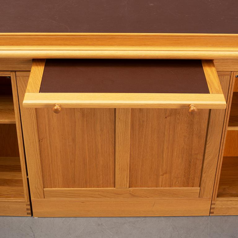 An oak writing desk by Finn N Hansen. End of the 20th Century.
