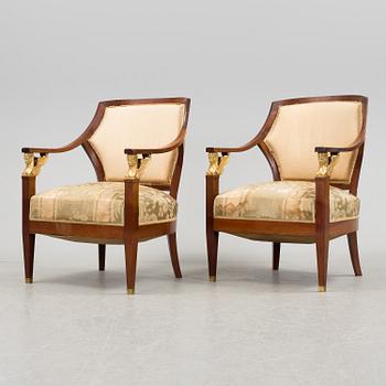A pair of early 20th century Empire style armchairs.