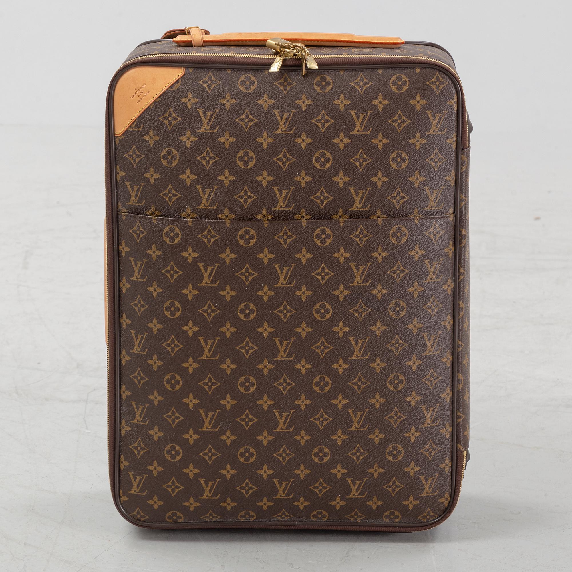 Louis Vuitton, a monogram canvas 'Pegase 55' suitcase, 2009.
