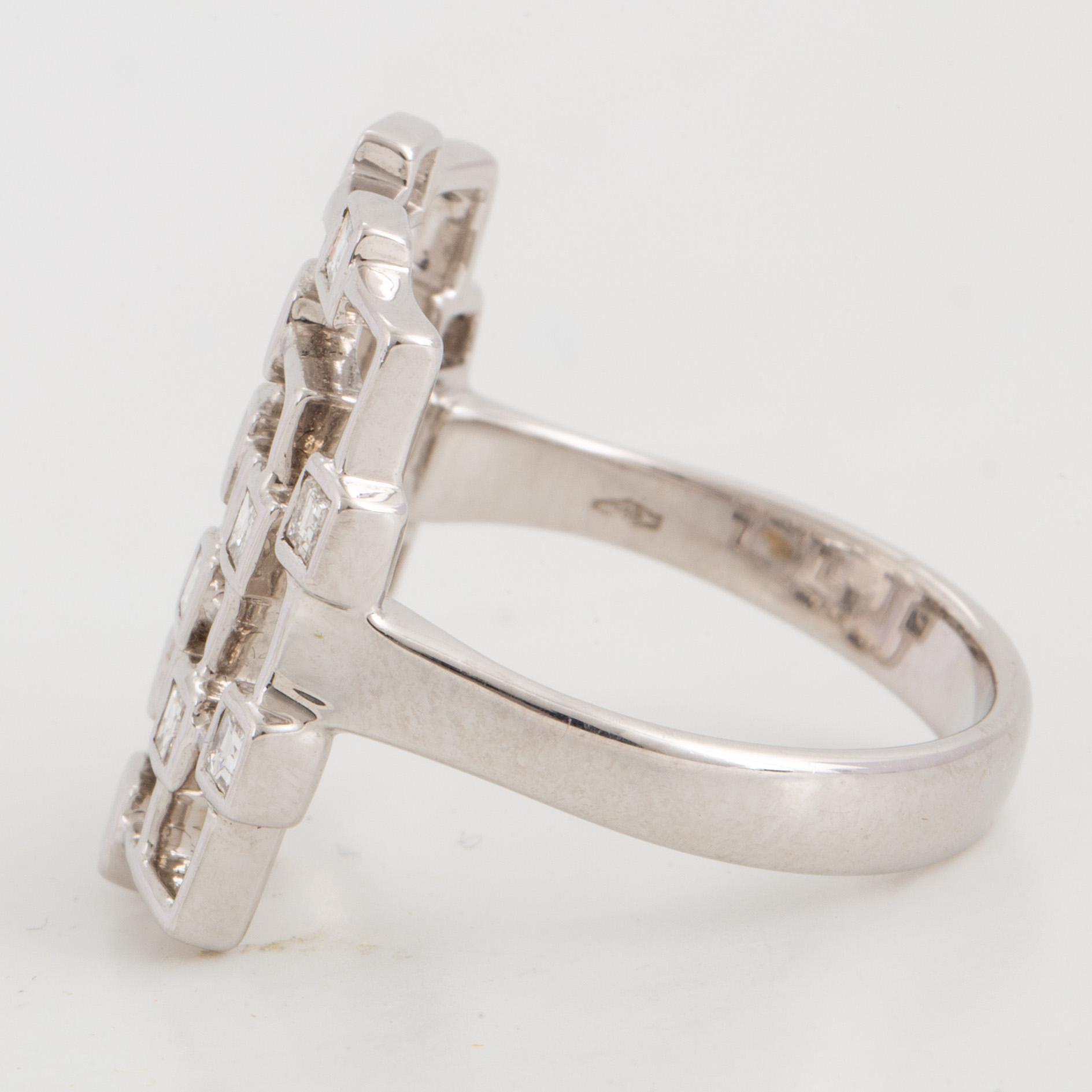 Step-cut diamond ring.