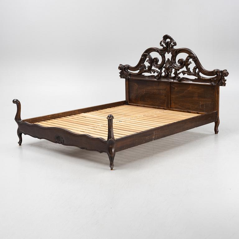 A rococo style bed frame, around 1900.