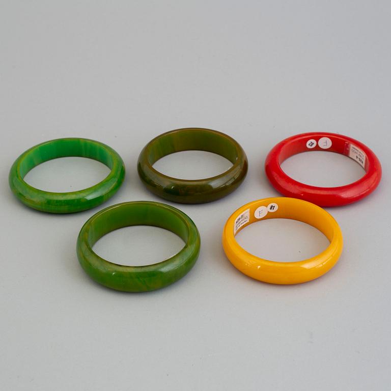 a set of eight plastic and bakelit bracelets, 20th century.