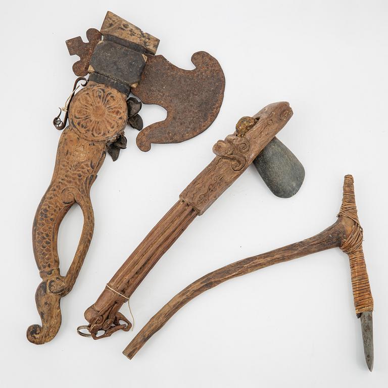 A set of three ceremonial Asmat axes and a sculpture object, Jakarta, Indonesia, 20th Century.