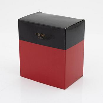 Céline, a gold tone bracelet.