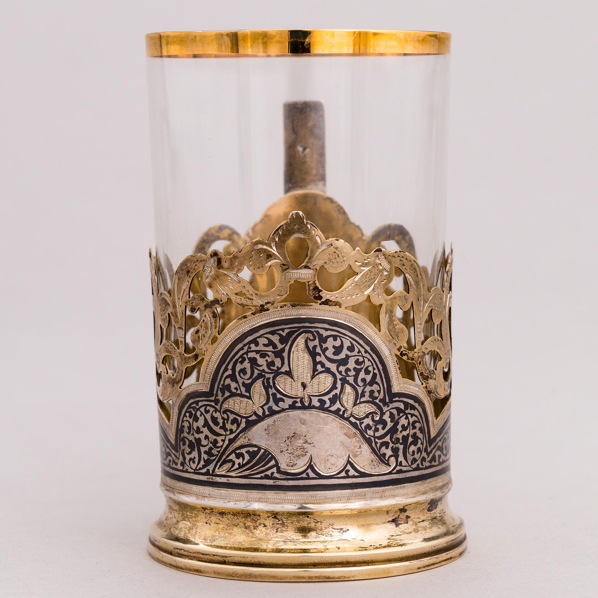 A Russian silver teaglass holder and seven teaspoons, Moscow and Kiev, first half and mid-20th Century.