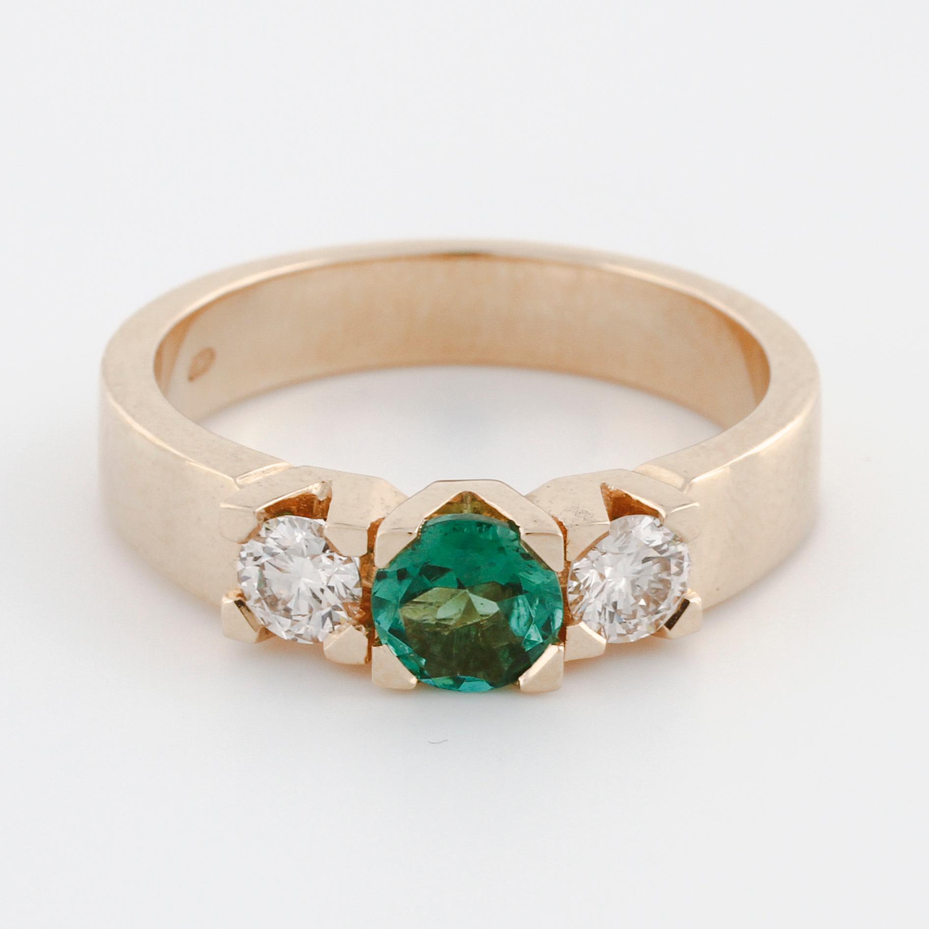 A green tourmaline rand brilliant cut diamond ring.