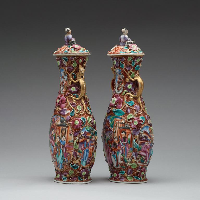 A pair of famille rose vases with covers, Qing dynasty, Qianlong (1736-95).