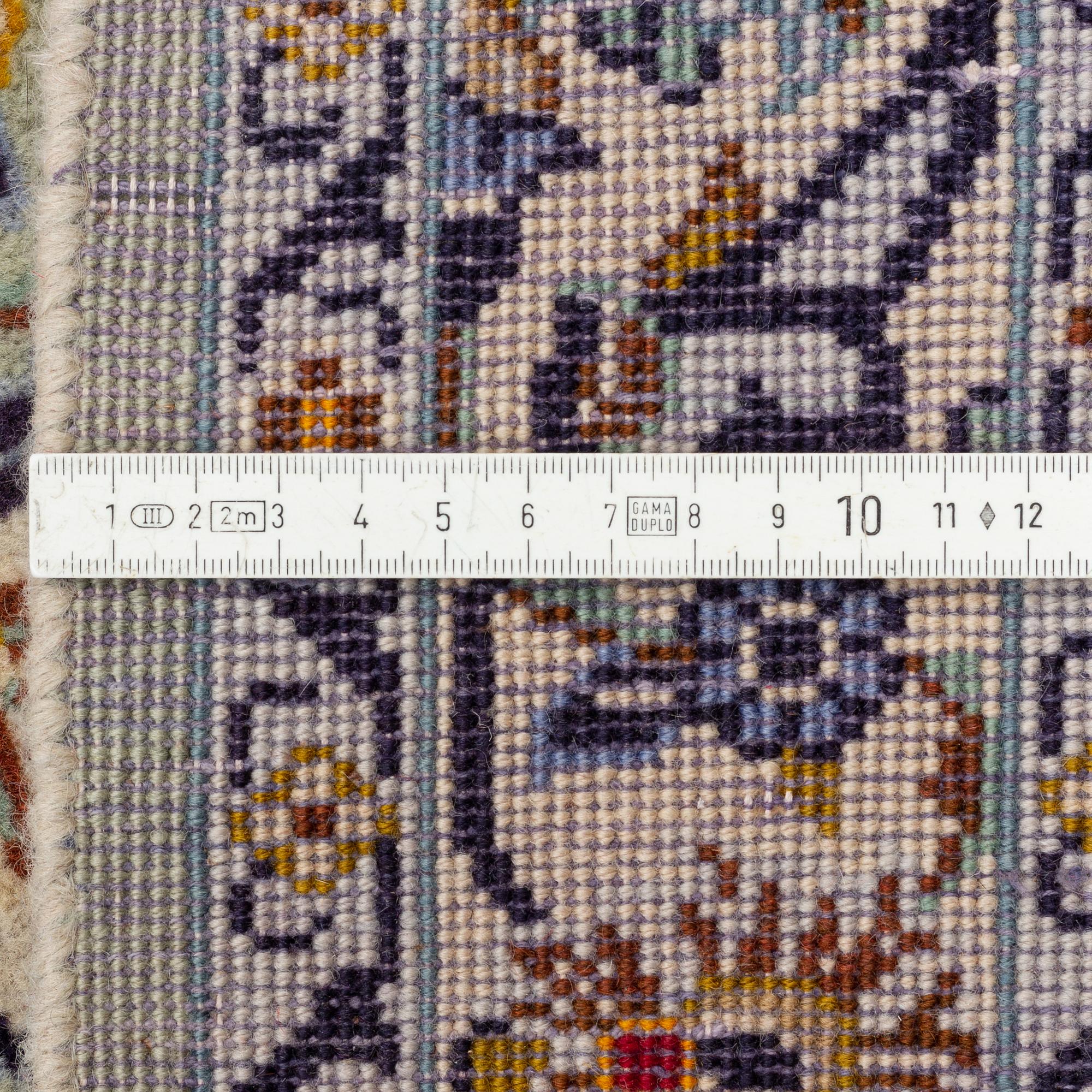 A Keshan carpet, signed, c. 410 x 297 cm.