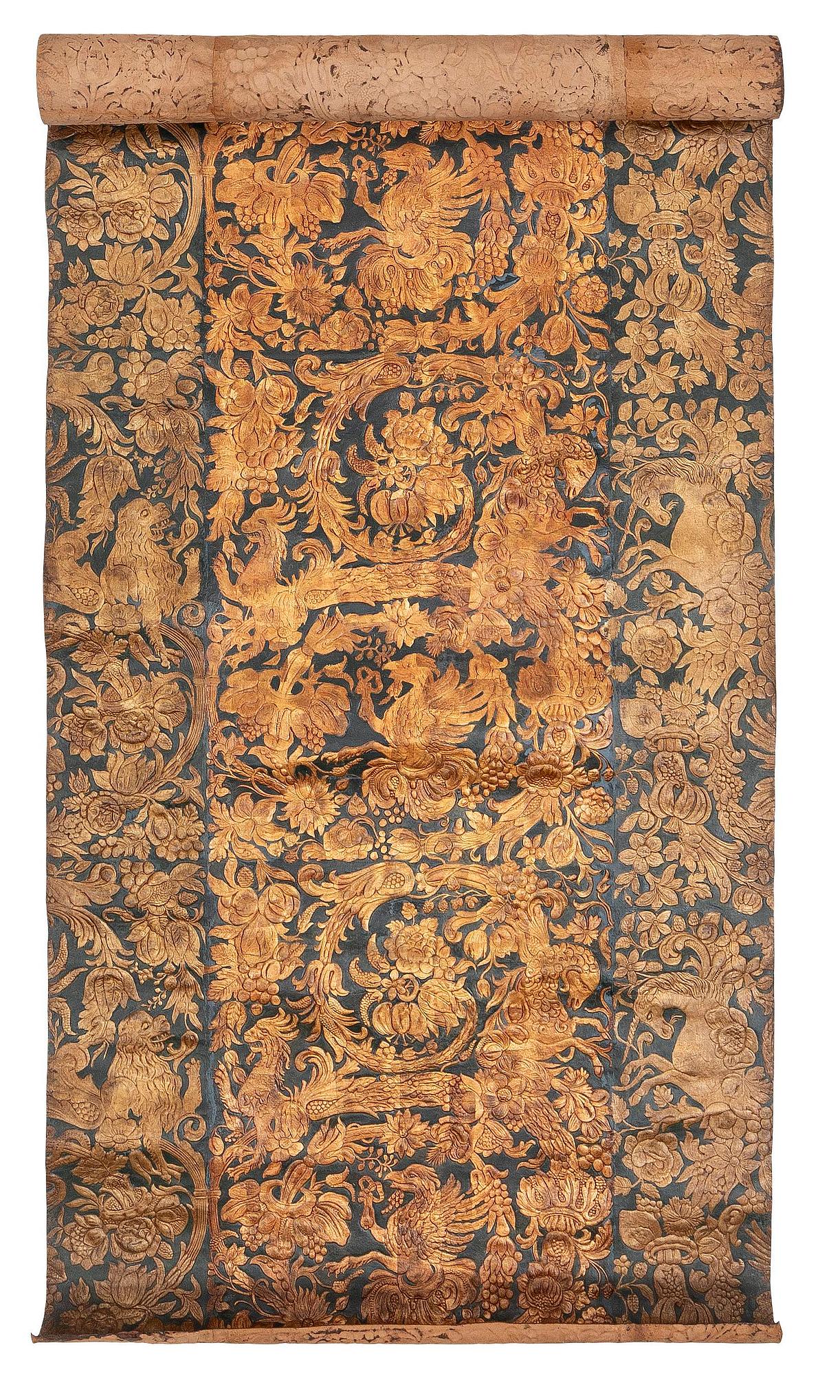 A 19th century wrought leather wallpaper, ca 388 x 97 cm.