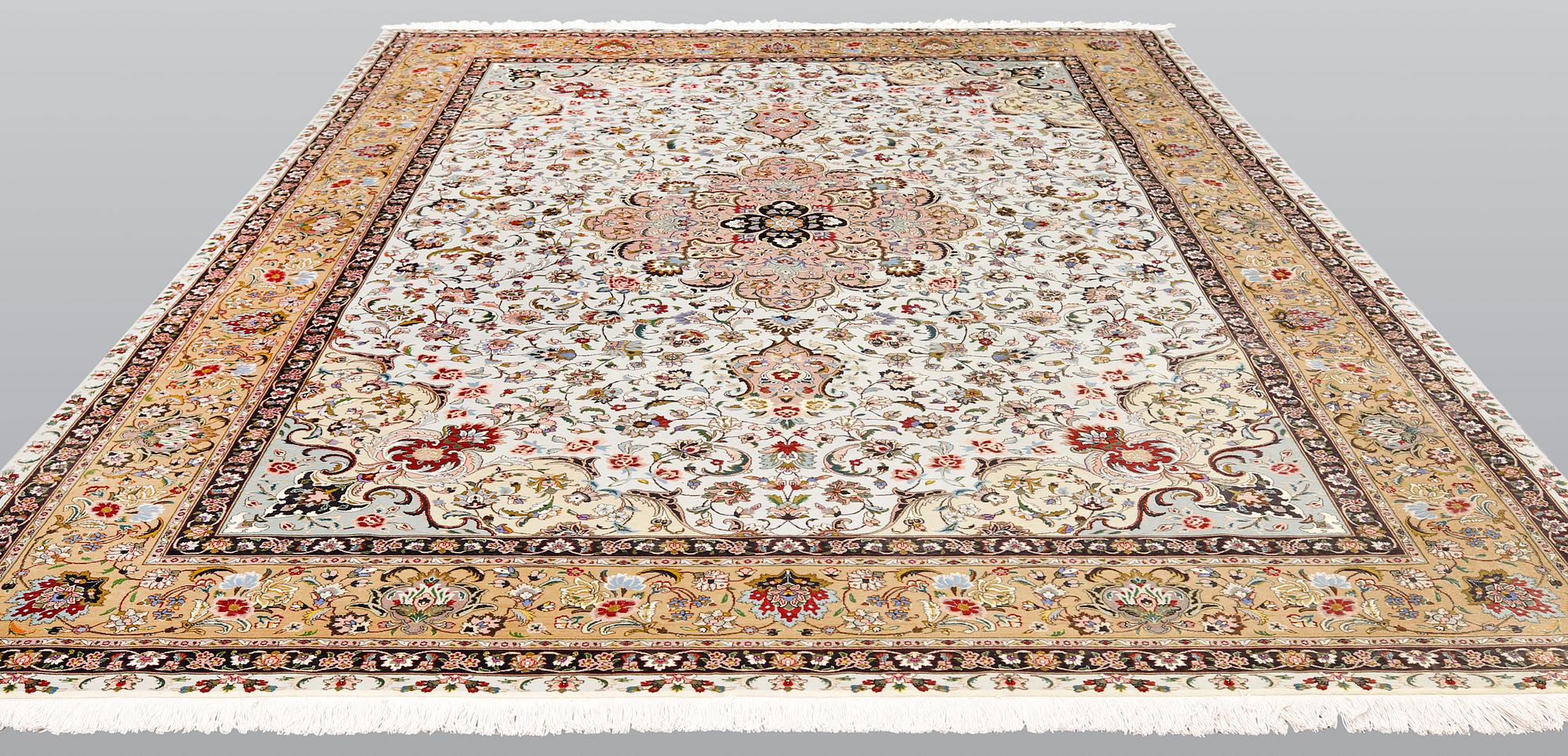 A part silk Tabriz carpet, so-called 50 Raj, approx. 348 x 252 cm.