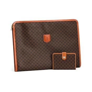 282. CÉLINE, a brown coated monogram canvas briefcase and wallet.