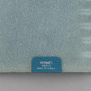Hermès, a blue leather notebook with two scripple pads.