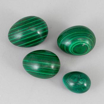 Four 20th century malachite eggs.