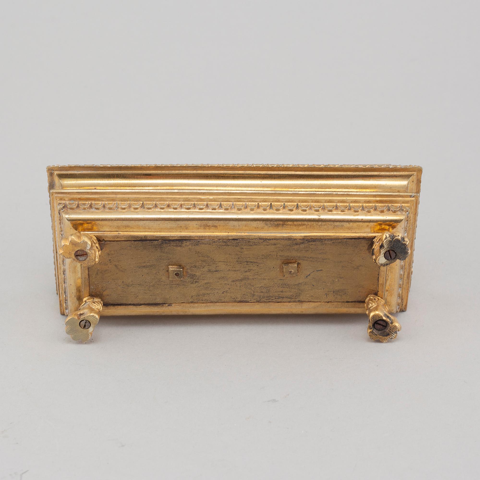 A bronze ink-stand in Empire style, around year 1900.