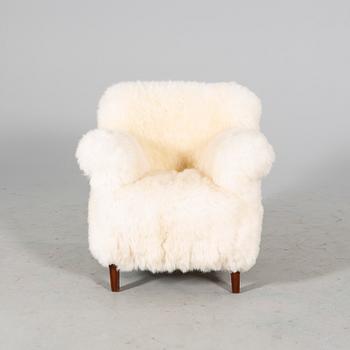 A 1940/50s cheep skin armchair.