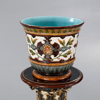 A Rörstrand pedestal with pot in majolica, made around year 1900.