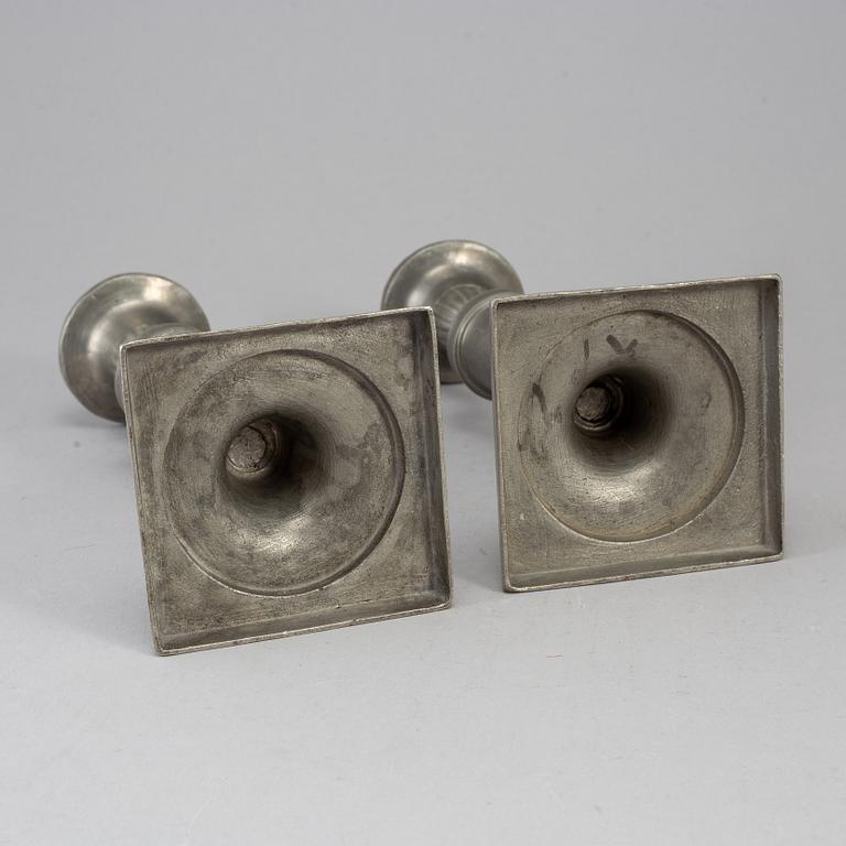 A pair of 18th century pewter candlesticks.