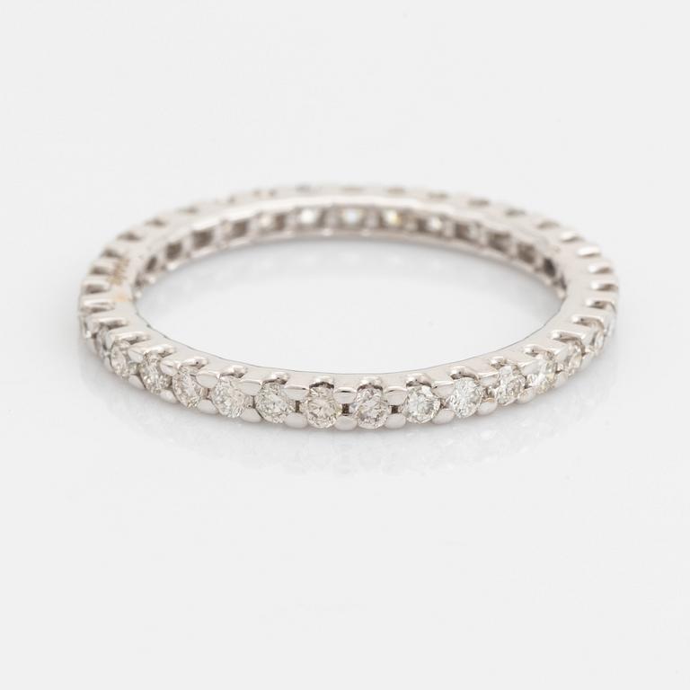 Brilliant-cut diamond eternity ring.