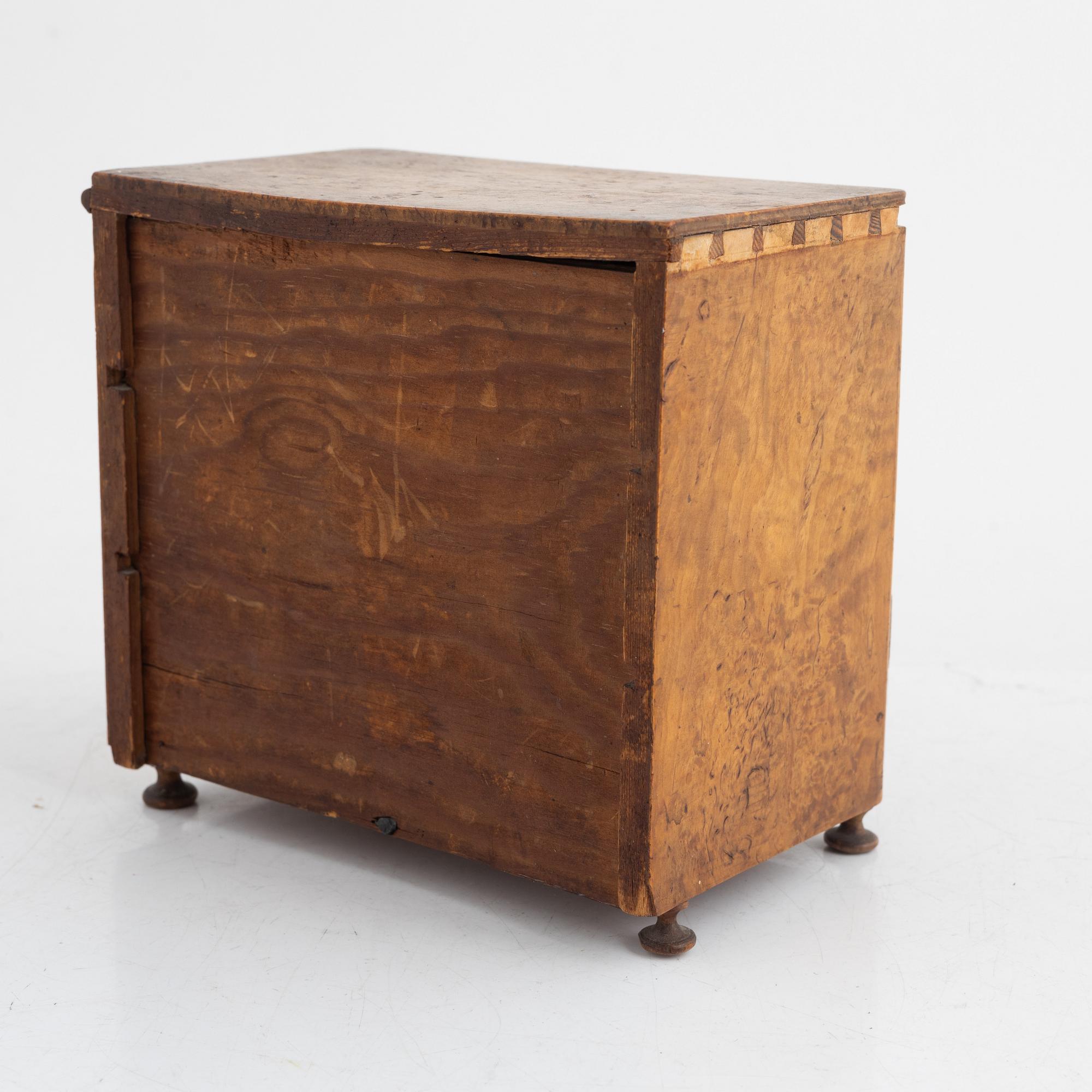 A Swedish miniature commode, 19th century.