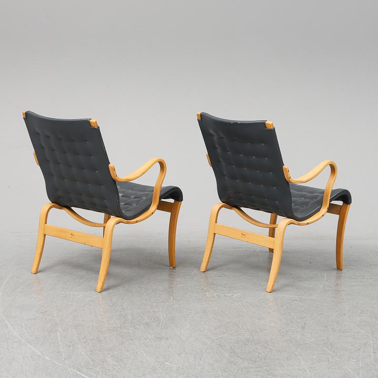 A second half of the 20th Century pair of 'Mina' armchairis by Bruno Mathsson for Mathsson International.