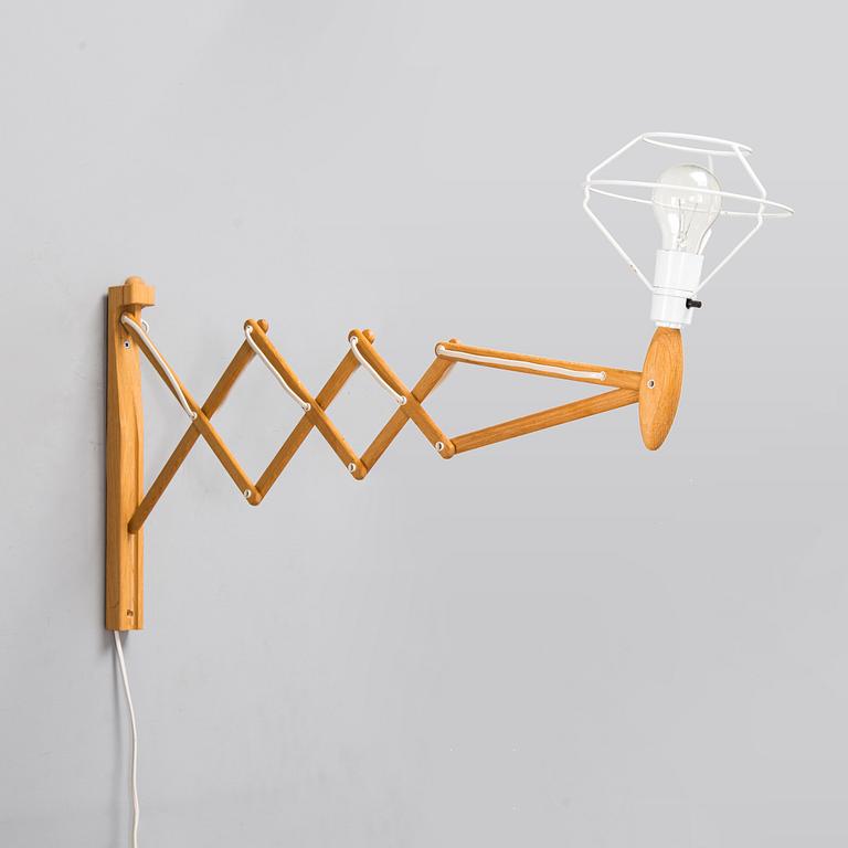 Erik Hansen, a model 317 wall lamp, 'Saxelampe'. Le Klint, Denmark.