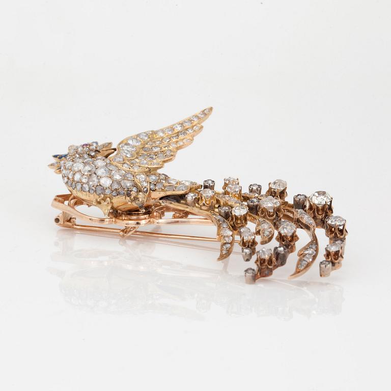 BROSCH, "Paradisfågel" med gammal- samt rosenslipade diamanter, safirer och rubiner.