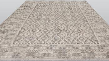 A Kelim carpet, c. 404 x 307 cm.