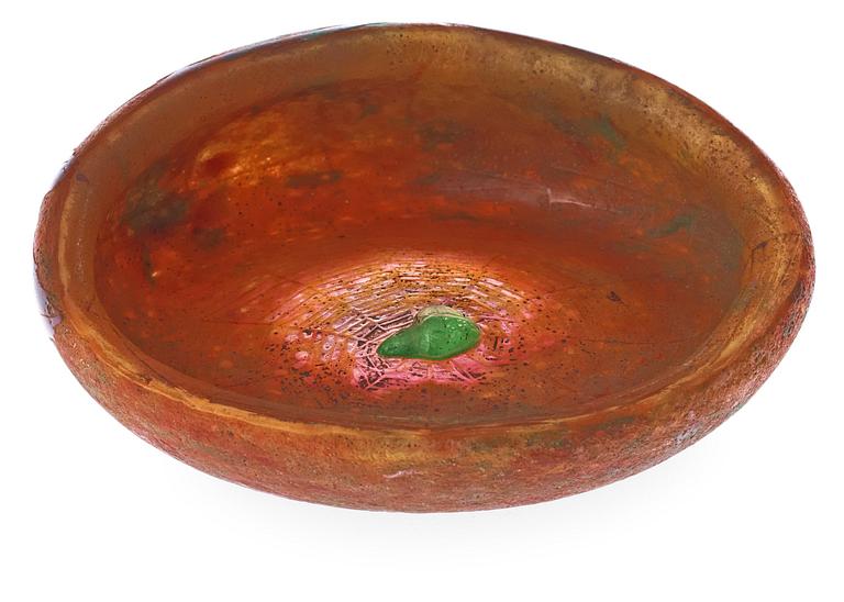A Daum Art Nouveau cameo glass bowl with a green spider in its webb, chestnut leaves.