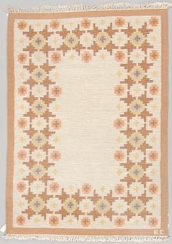 A CARPET, flat weave, ca 242,5 x 170 cm, signed EC, probably India second half of the 20th century.