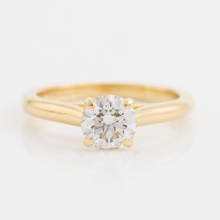 Cartier 18K gold and brilliant cut diamond solitaire ring.