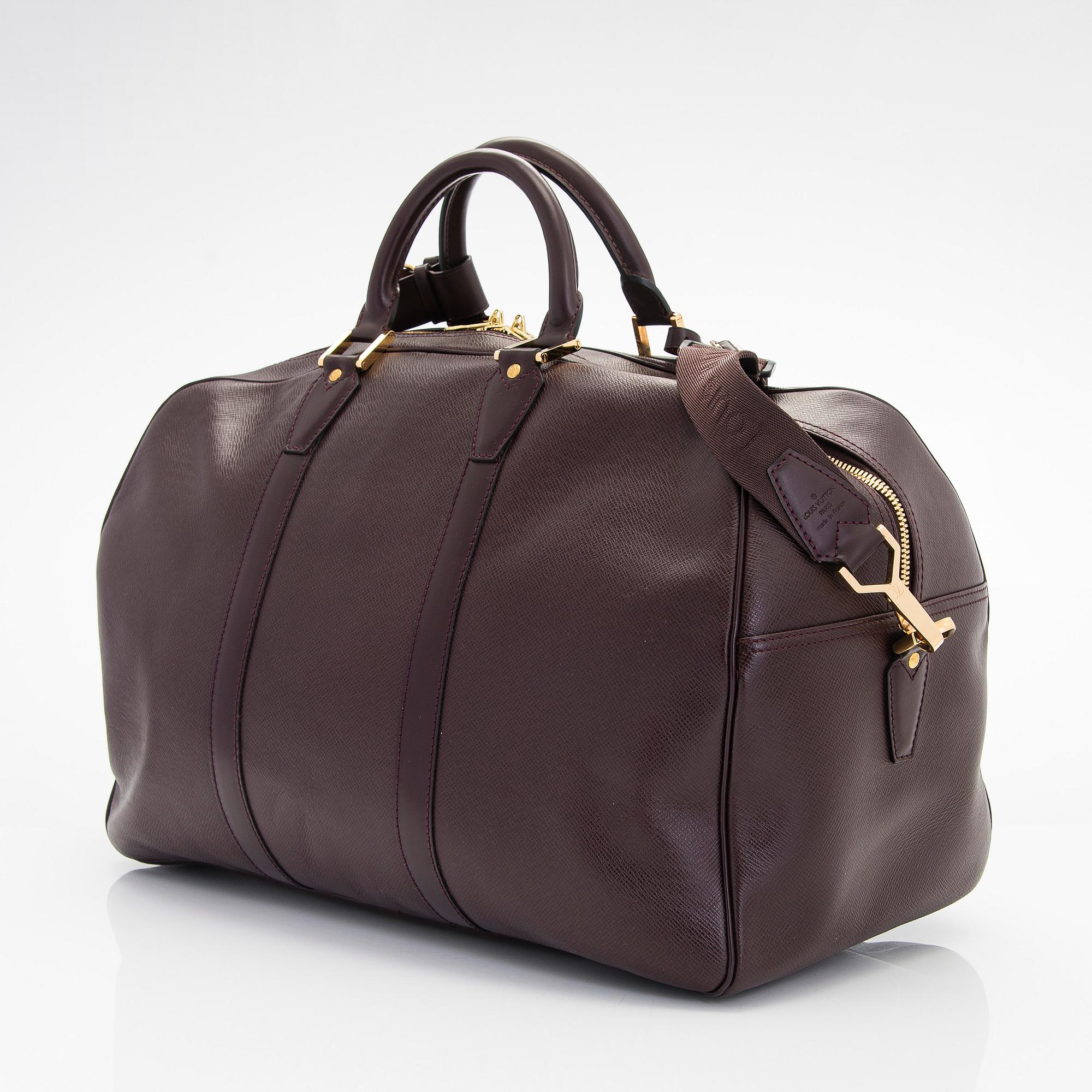 Louis Vuitton, a 'Taiga Kendall PM' weekend bag.