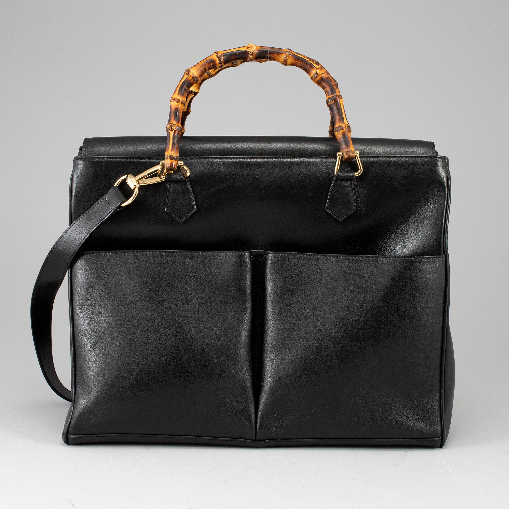 GUCCI, a leather bag/briefcase.