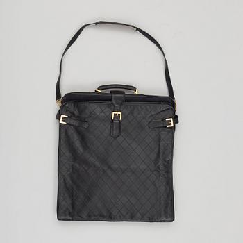 a CHANEL garment bag.