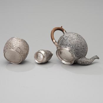 A three-piece Persian silver set for tea.