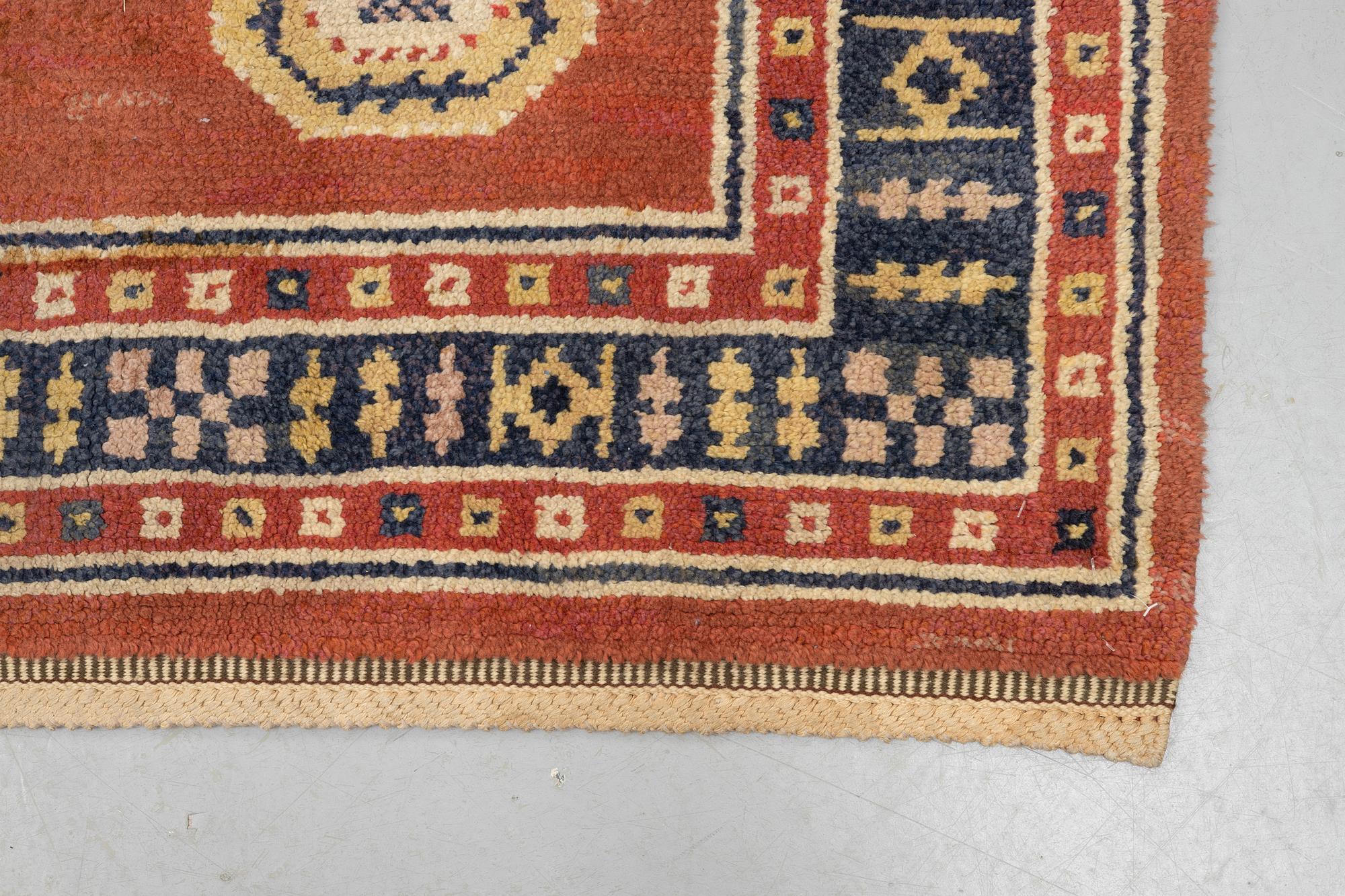 Märta Måås-Fjetterström, a carpet, "Röd Flossa", knotted pile, ca 300 x 272 cm, signed AB MMF.