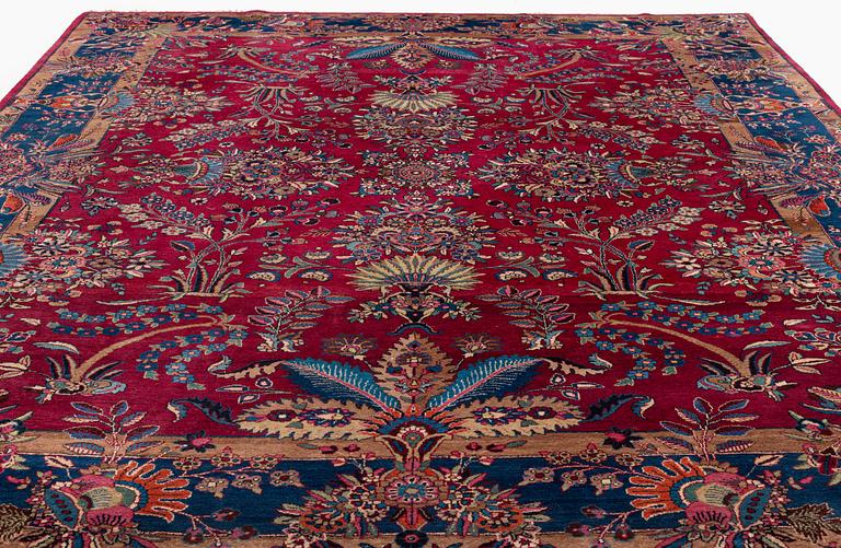 A semi-antique Mashad carpet, northeastern Persia, c. 404 x 307 cm.