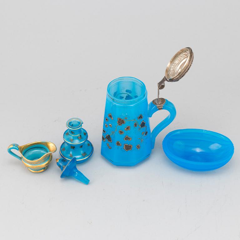 A silver gilt turkoise glass tankard, bottle with stopper, bowl and a small creamer, 19th Century.