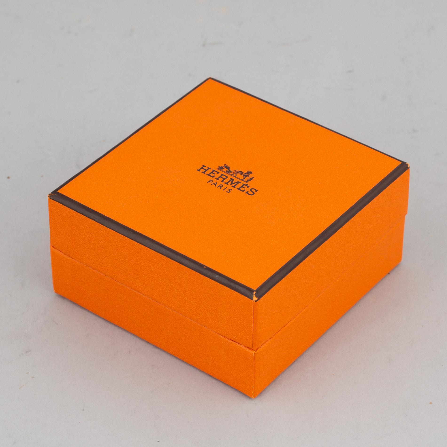 HERMÈS, a 'Clic H' bangle.