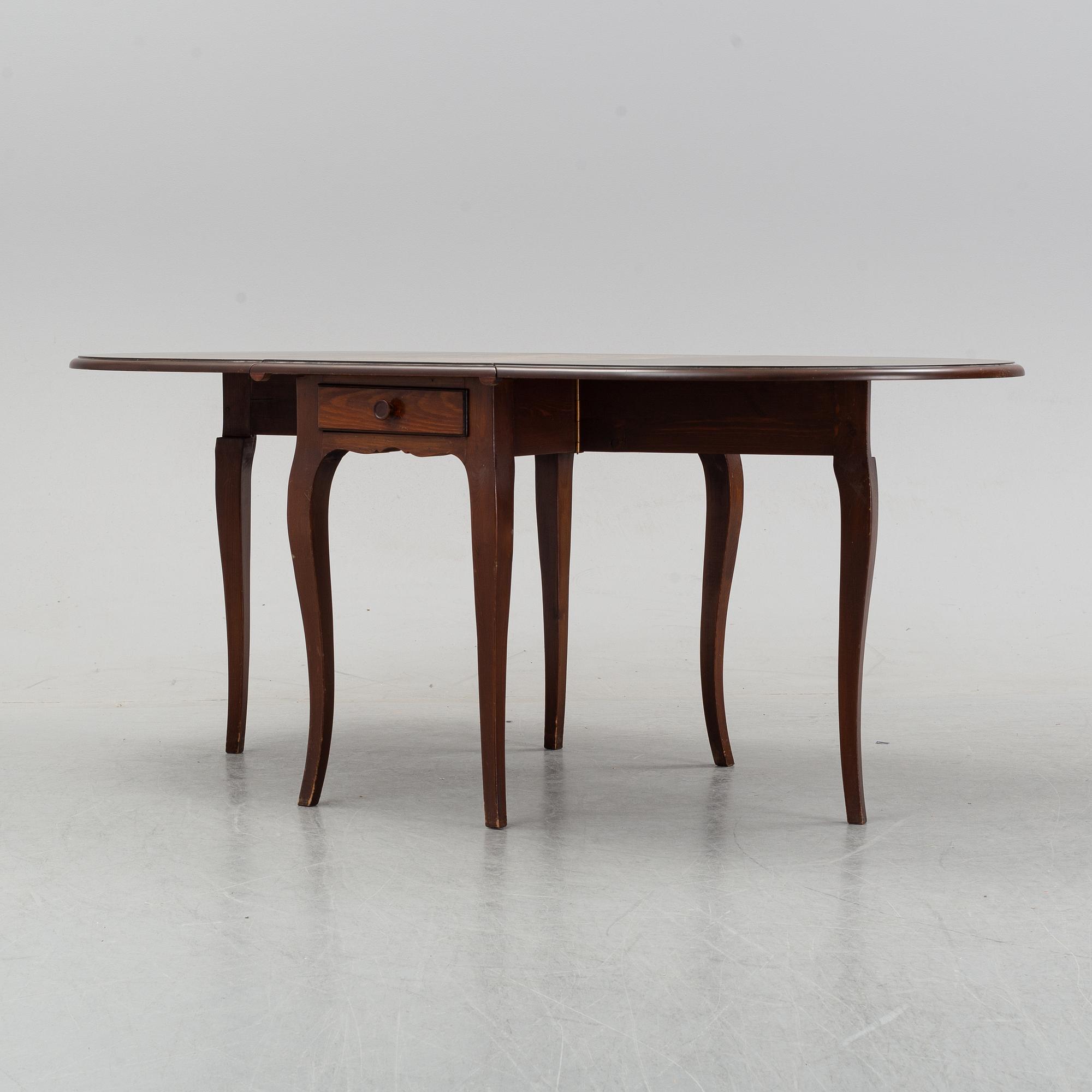 A stained pine gate-leg table, Åmells möbler.