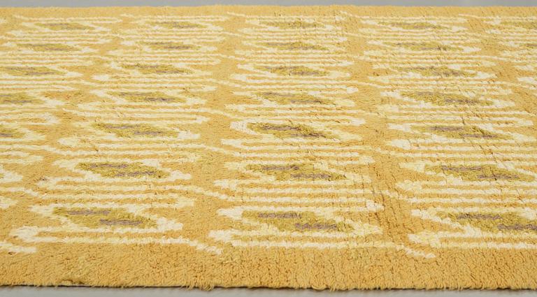 Brita Grahn, A CARPET, knotted pile, ca 429 x 201 cm, signed H & M Brita Grahn as well as SKOKLOSTER 1949.