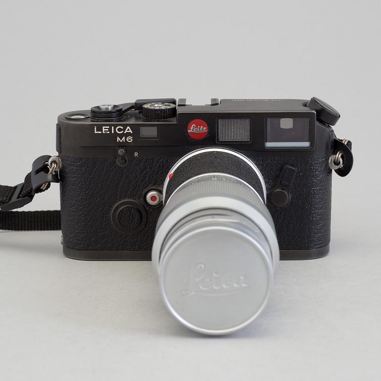 A black body Leica M6 no 1725111 from 1987 with Elmar 1:4/135. With original box.