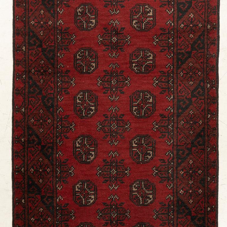 An oriental / Afghan runner, approx. 478 x 81 cm.