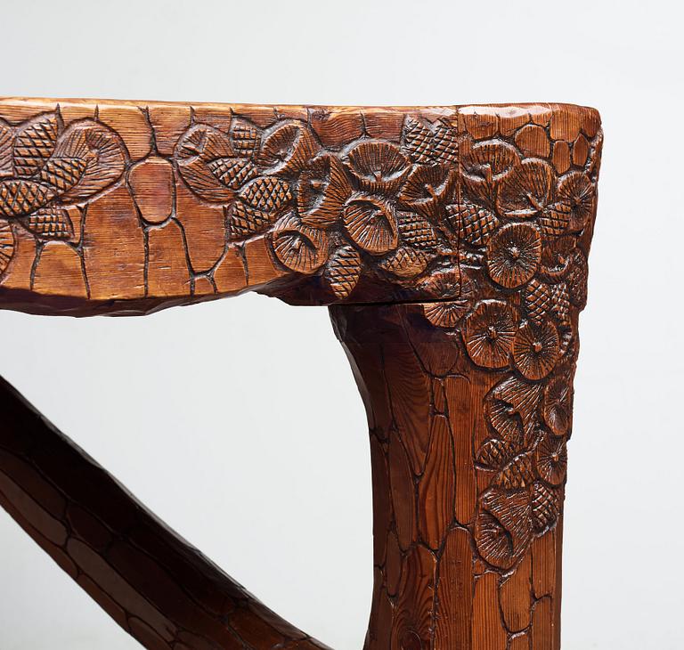 Gustaf Fjaestad, an Art Nouveau carved pine table, Arvika Sweden 1914, a double to the table in the Thiel Collection,