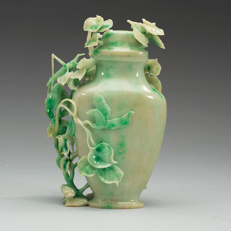 A Chinese elaborately carved nephrite vase with cover, 20th Century.