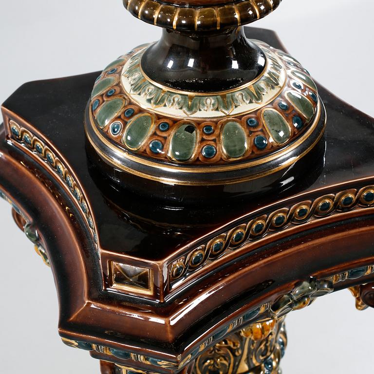 A majolica urn with pedestal from Rörstrand, around the year 1900.