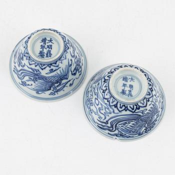 a pair of blue and white cups and three dishes, China, late Qing dynasty.