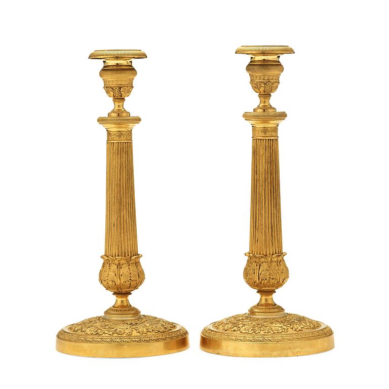 A pair of Empire early 19th century candlesticks.